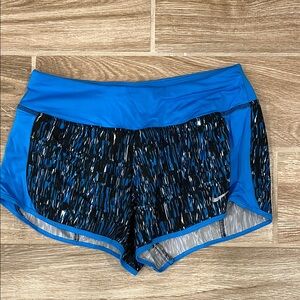 Nike Blue Athletic Shorts with Black Design and Mesh Overlay